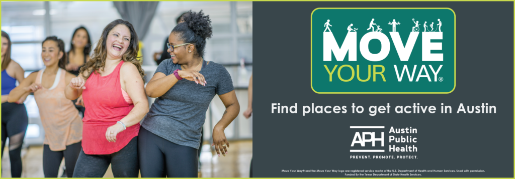 Hispanic woman and African American woman dancing together in an exercise class