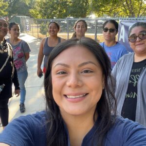 Women taking a selfie with their walking group during a walk.